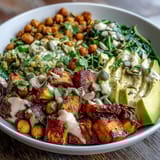 Roasted Sweet Potato and Chickpea Bowl with garlicky spinach and avocado.