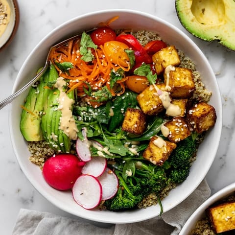 This fresh Buddha Bowl features juicy chicken, crisp broccoli, brown rice, and pickled onions, topped with toasted sesame seeds.