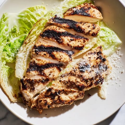 Juicy grilled chicken sandwiches with crisp romaine lettuce, creamy Caesar dressing, and golden toasted buns.