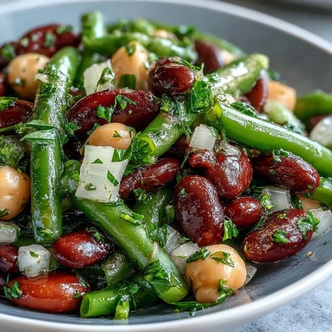Fresh Three-Bean Salad, a vibrant mix ready for a summer potluck or healthy side.