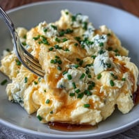 Fluffy scrambled eggs mixed with creamy cottage cheese for a protein-rich breakfast.  